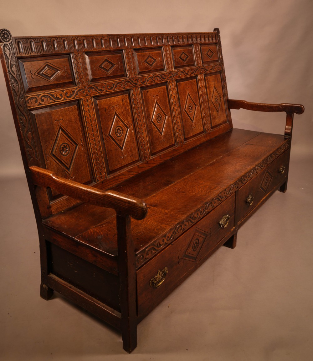 A Georgian Oak Settle with storage drawers View II