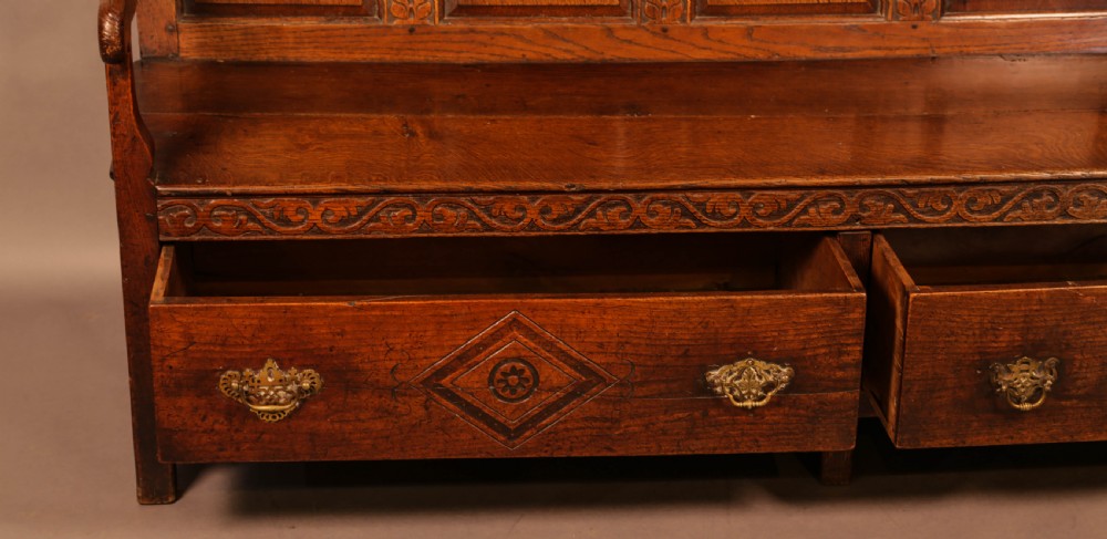 A Georgian Oak Settle with storage drawers View VI