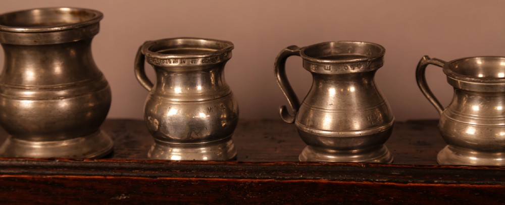 A collection of 6 pewter tankards antique View III