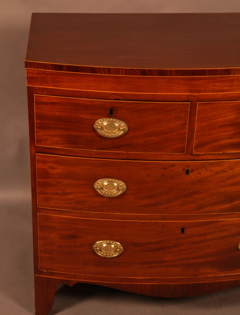 An early 19th century Bow Chest of Drawers Mahogany View III