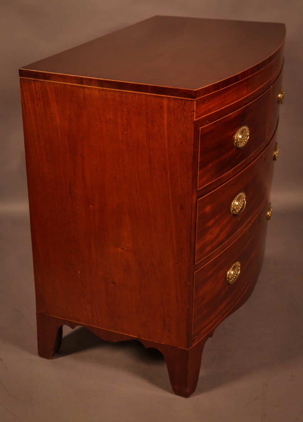 An early 19th century Bow Chest of Drawers Mahogany View V