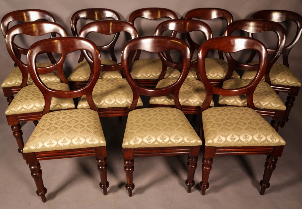 A Set of 12 Victorian Mahogany Balloon Back Dining Chairs