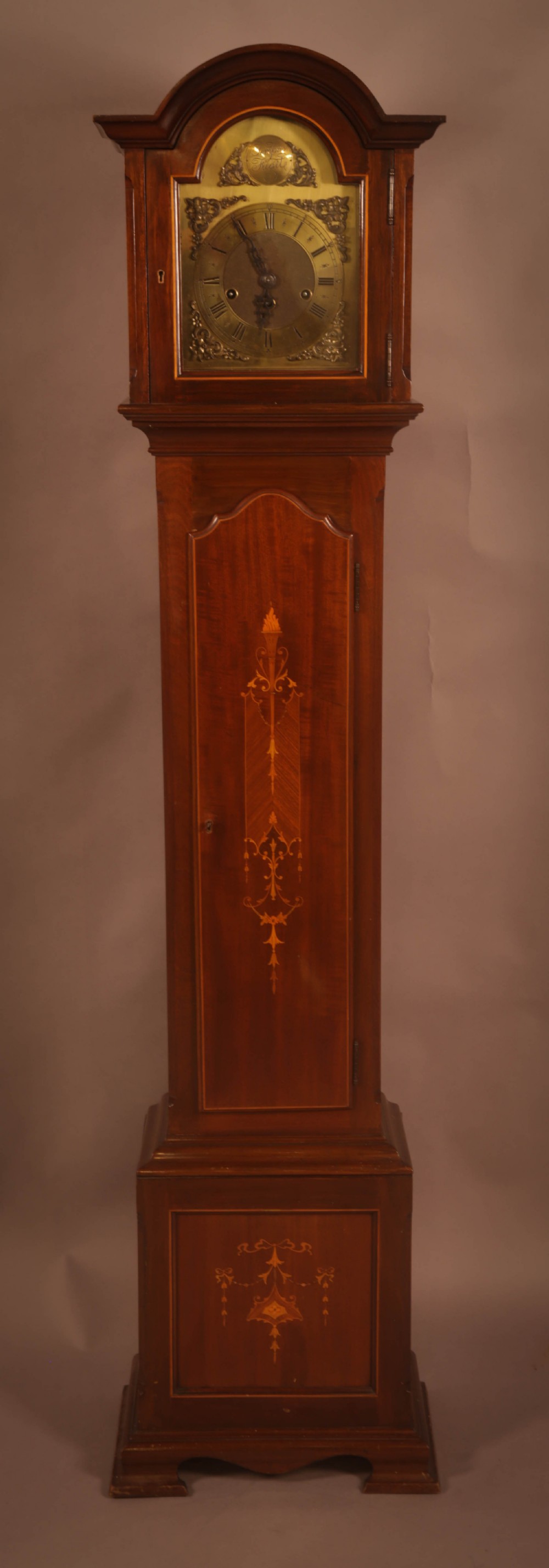 An 1920s Grandaughter longcase clock