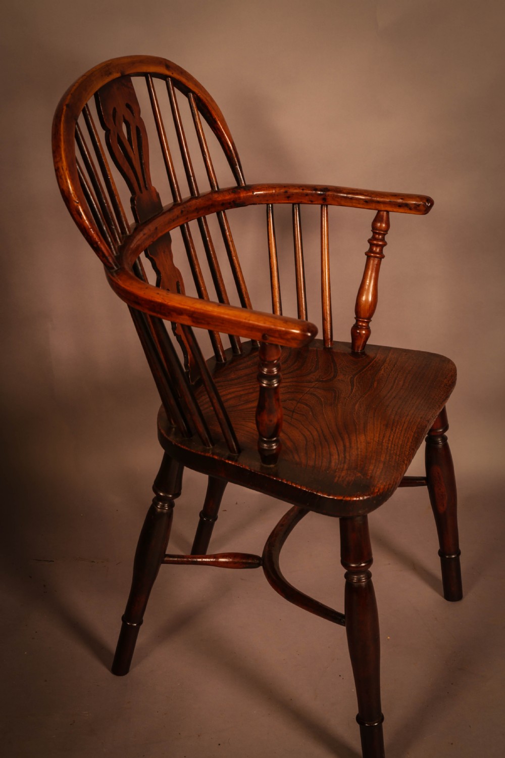A Yew Wood low back Windsor Chair by Whitworth of Gamston