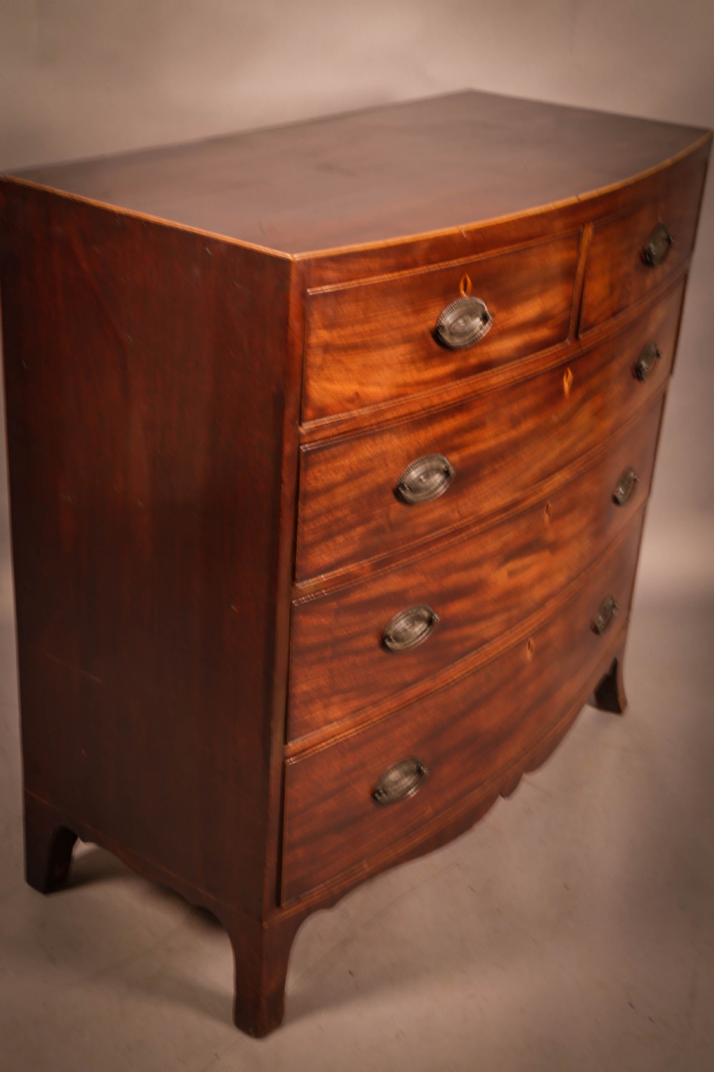 A Georgian Bow Front Chest of Drawers View II