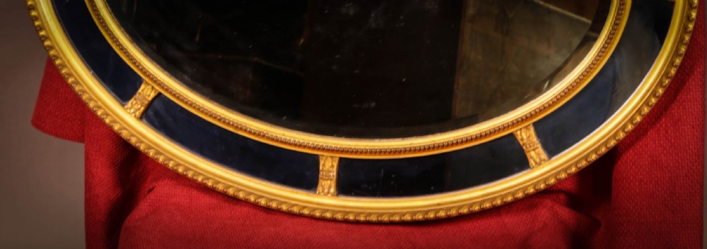 An Oval Mirror segmented with Blue Glass Rare View III