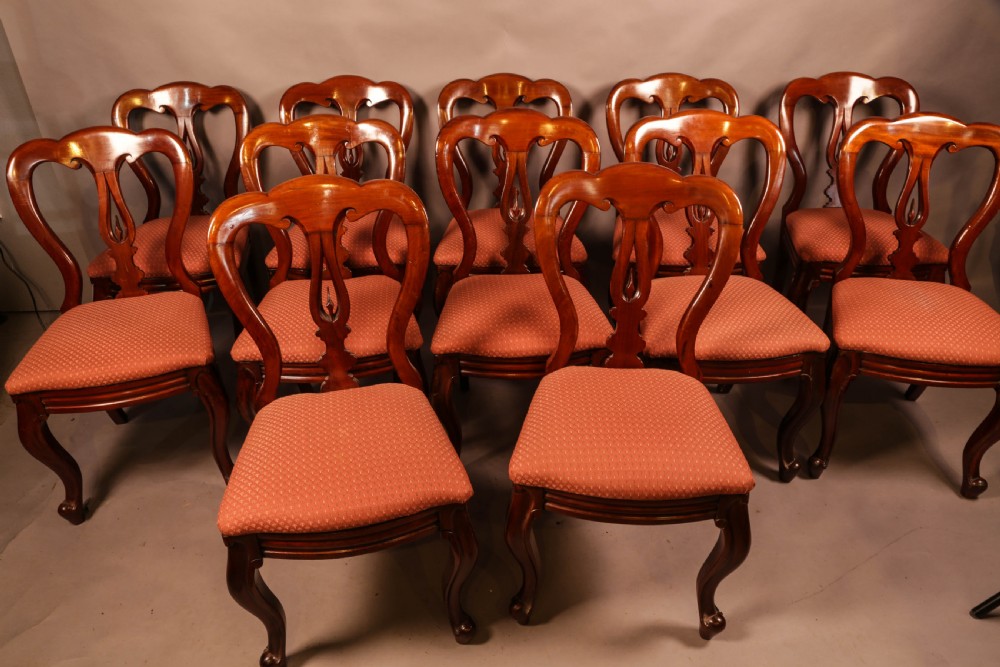 A Good set of 12 Victorian Mahogany Spear Point Balloon Back Dining Chairs