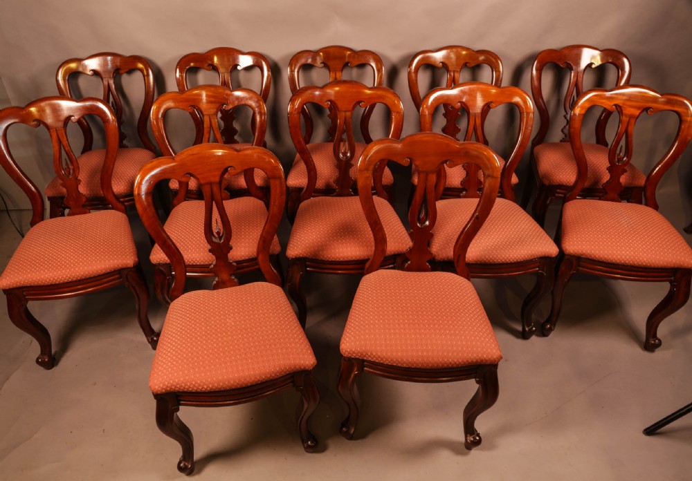 A Good set of 12 Victorian Mahogany Spear Point Balloon Back Dining Chairs View II