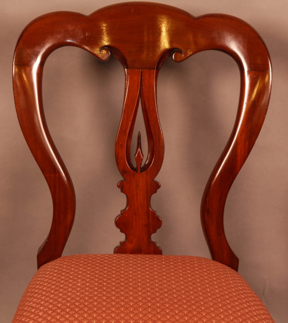 A Good set of 12 Victorian Mahogany Spear Point Balloon Back Dining Chairs View X
