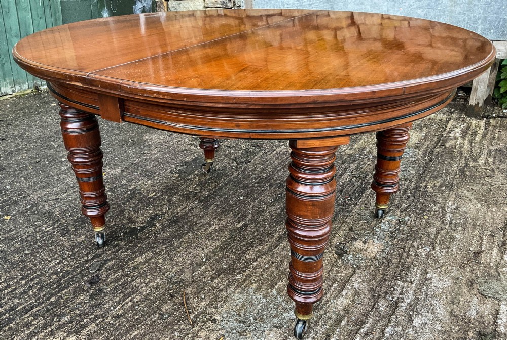 A Victorian 3 leaf Extending Dining Table in Walnut View VI