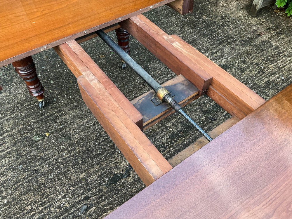 A Victorian 3 leaf Extending Dining Table in Walnut View XI