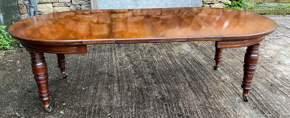 A Victorian 3 leaf Extending Dining Table in Walnut View XVI