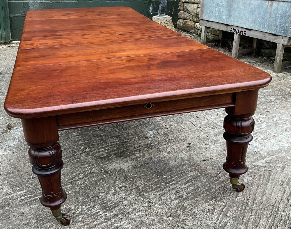 A Good Victorian Mahogany Extending Dining Table seat 12 View II