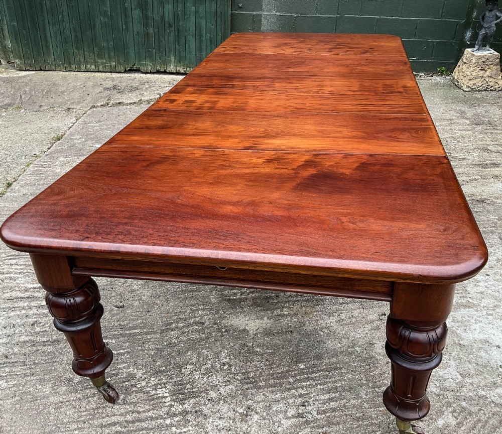 A Good Victorian Mahogany Extending Dining Table seat 12 View XI