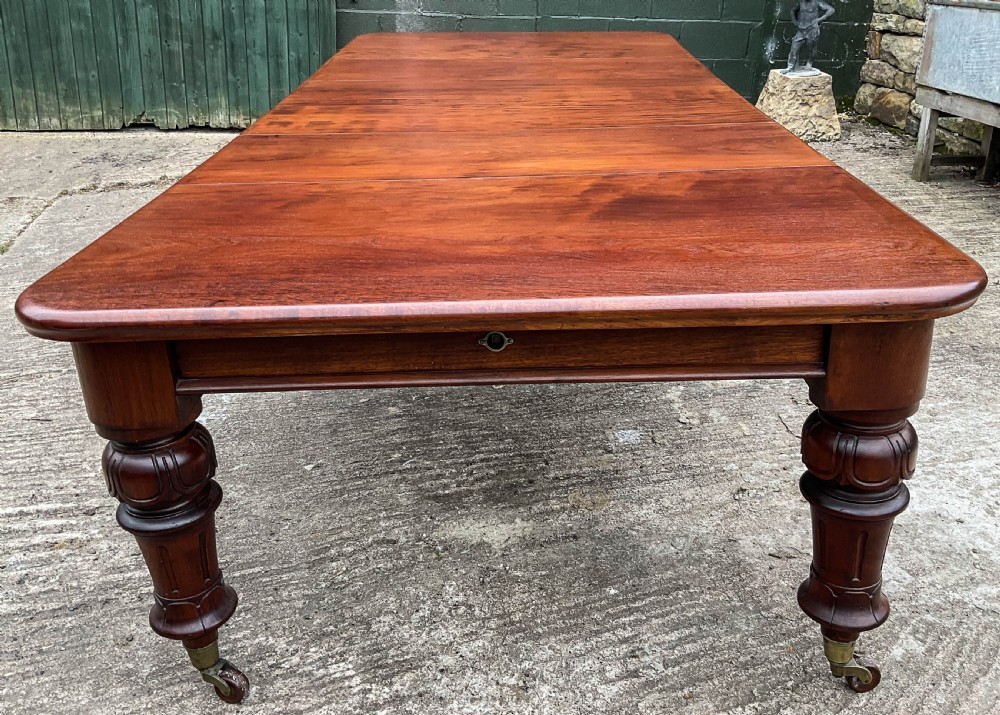 A Good Victorian Mahogany Extending Dining Table seat 12 View XII