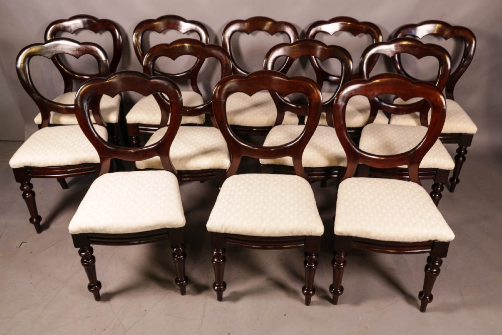 A Set of 12 Victorian Mahogany Balloon Back Dining chairs