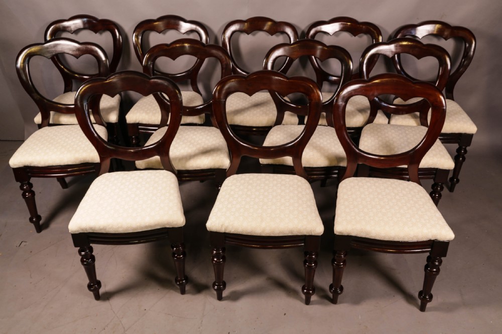 A Set of 12 Victorian Mahogany Balloon Back Dining chairs View II