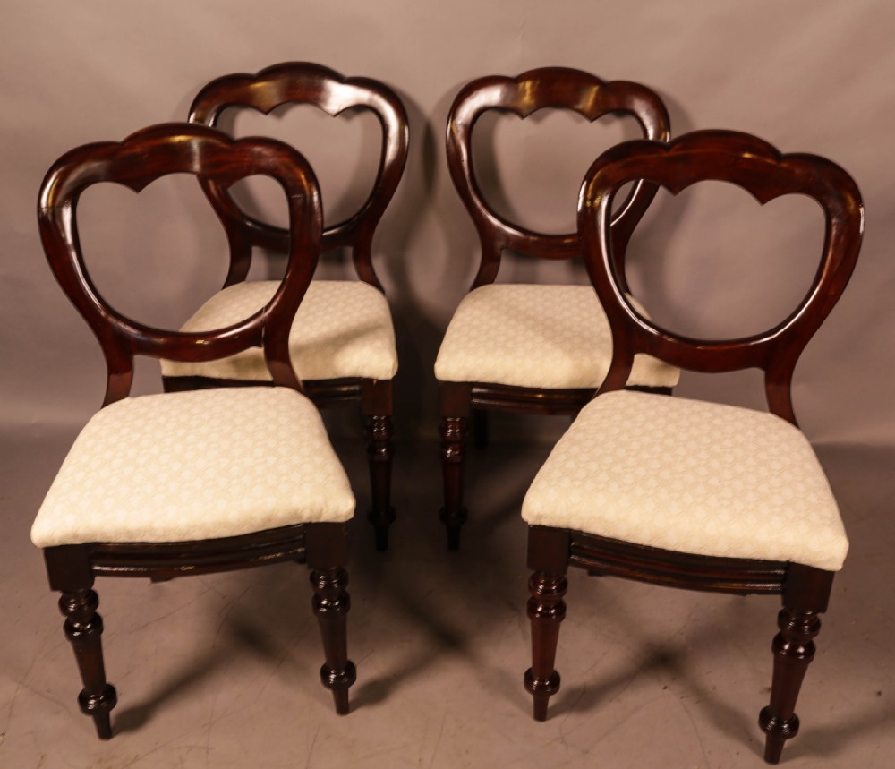 A Set of 12 Victorian Mahogany Balloon Back Dining chairs View VIII