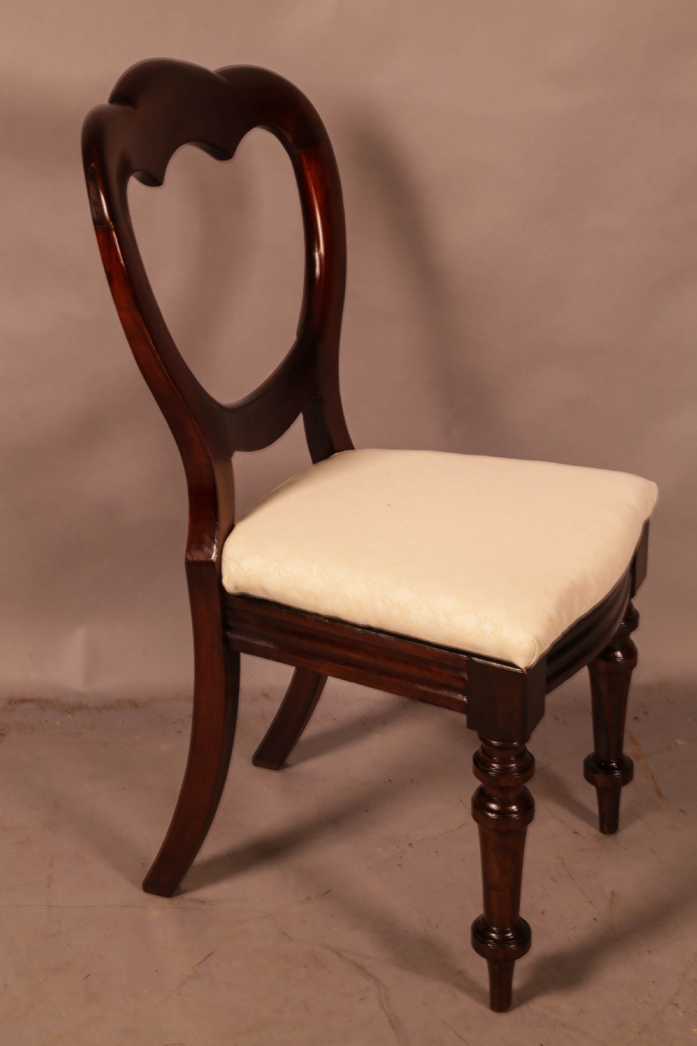 A Set of 12 Victorian Mahogany Balloon Back Dining chairs View X