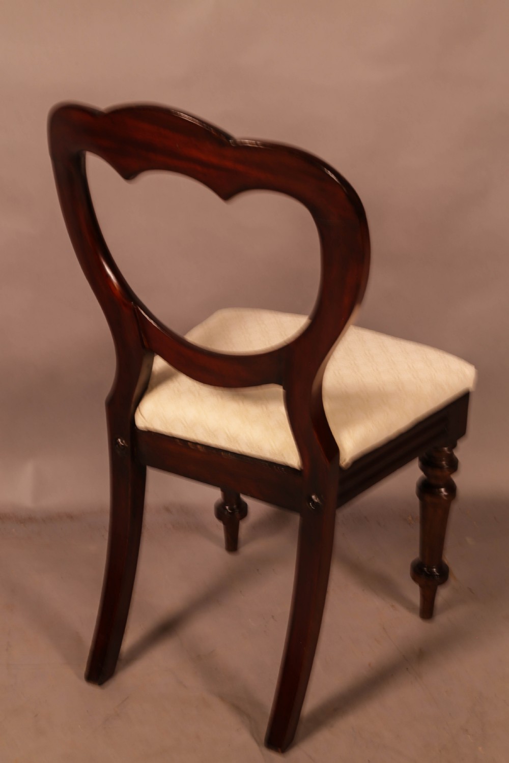 A Set of 12 Victorian Mahogany Balloon Back Dining chairs View XI