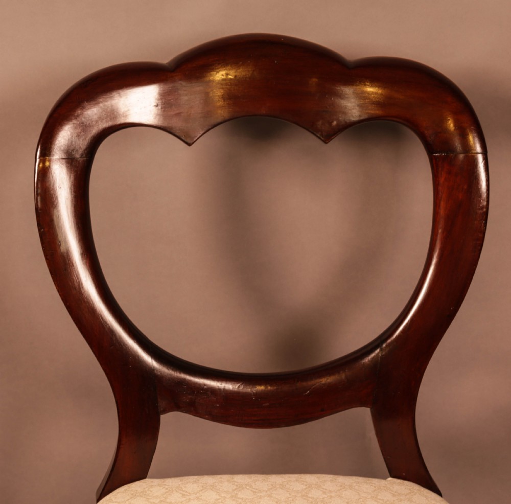 A Set of 12 Victorian Mahogany Balloon Back Dining chairs View XII