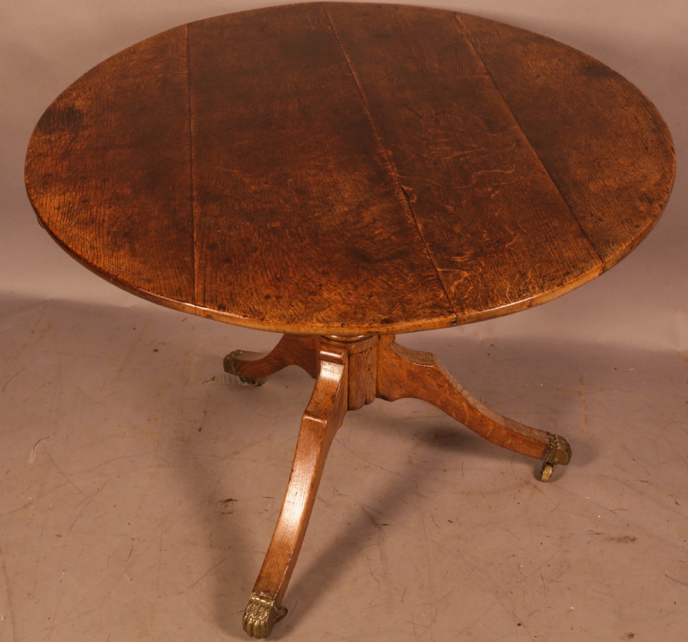 A Large Oak Tripod Supper Table View III