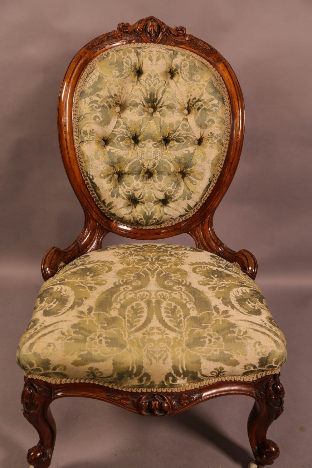 A Good Victorian Nursing Chair in Solid Walnut