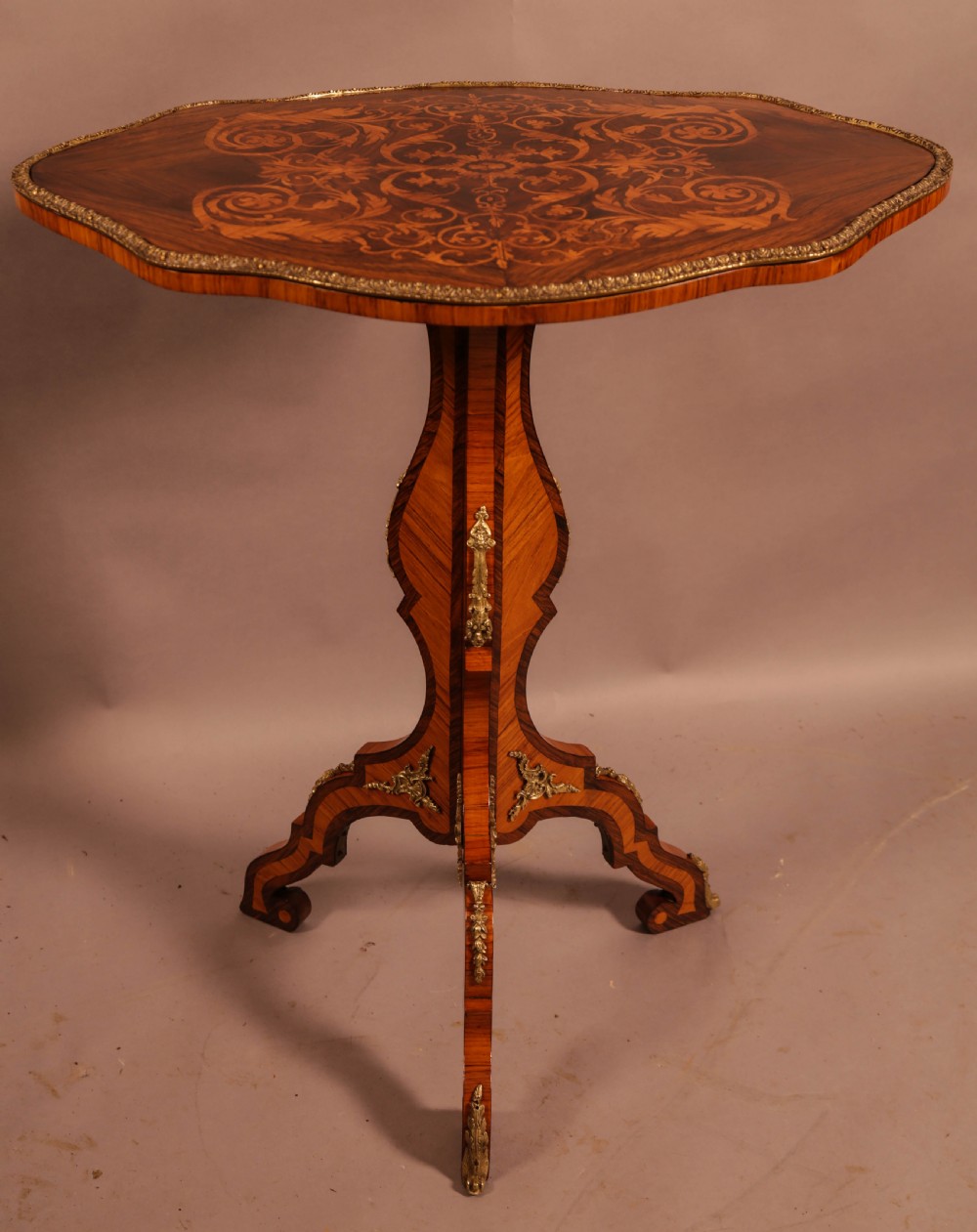 A French ocasional table in King Wood and Rosewood Inlaid