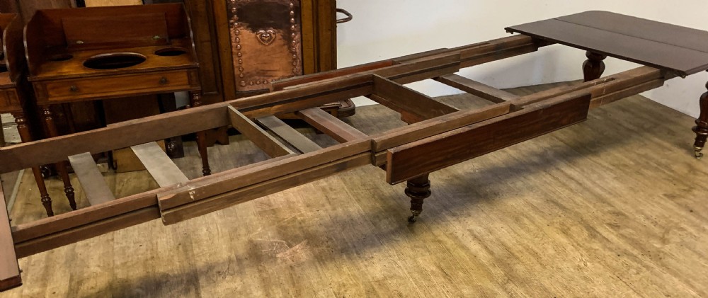 A Very Large Victorian Extending Dining Table in Mahogany seat 12/14 View XI