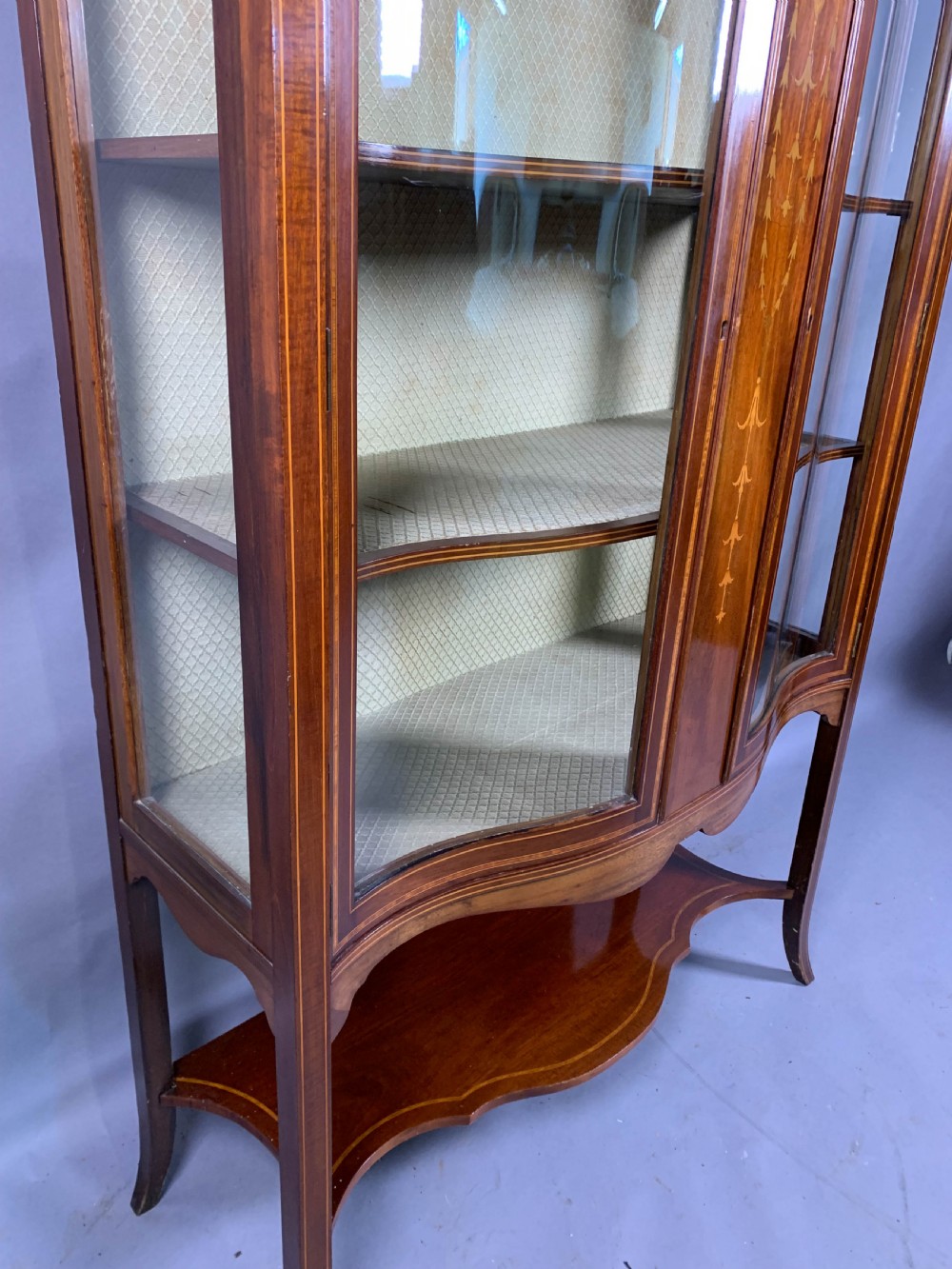 A Late Victorian Mahogany with inlay serpentine shape display cabinet View VIII
