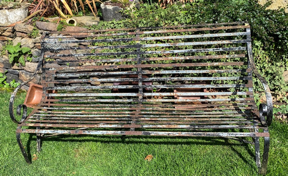 A Wrought Iron Garden Bench old paint
