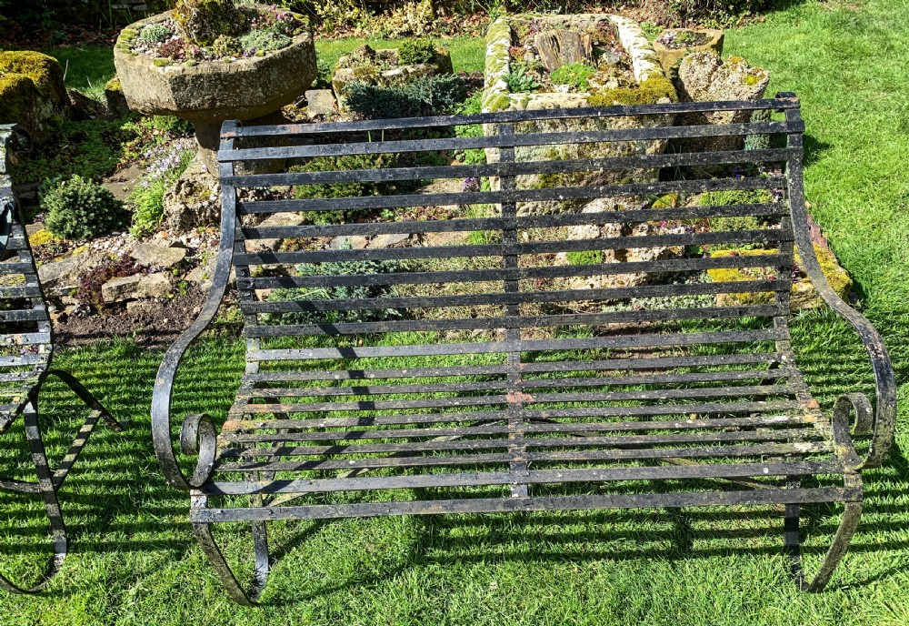 A Rare Matching Pair of Wrought Iron Garden Benches View II