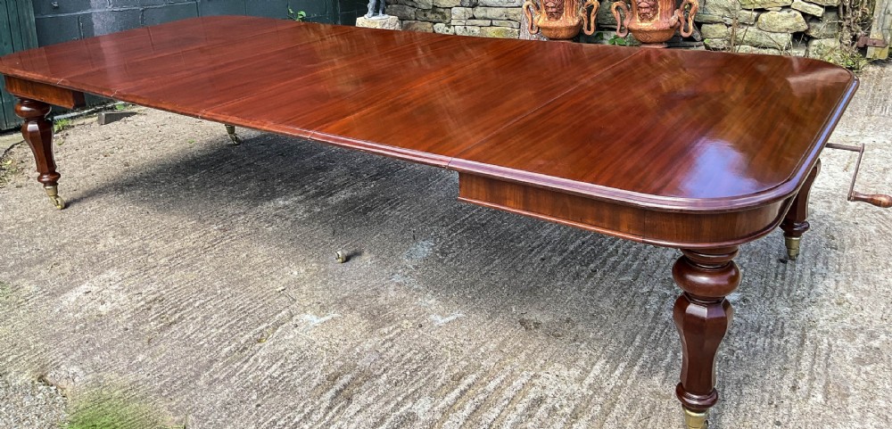 A Superb Early Victorian Extending Dining Table 4 leaves seats 12