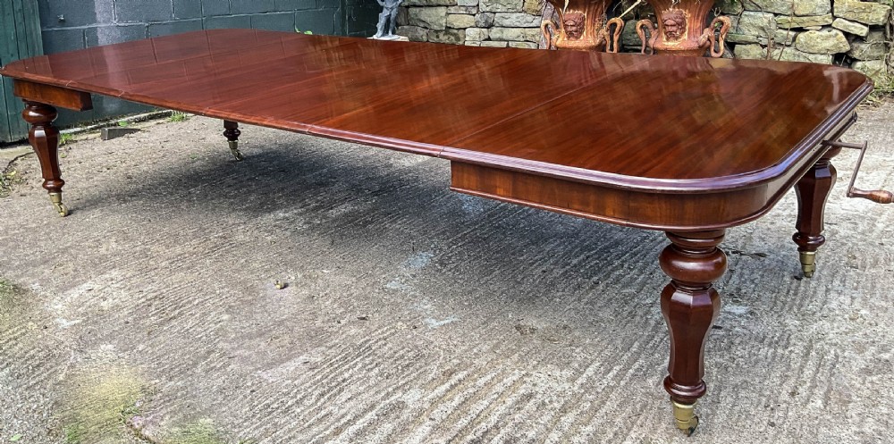 A Superb Early Victorian Extending Dining Table 4 leaves seats 12 View II