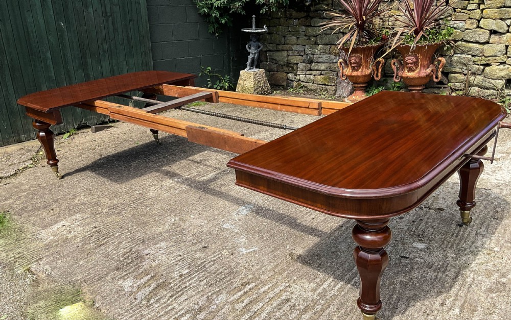 A Superb Early Victorian Extending Dining Table 4 leaves seats 12 View VI