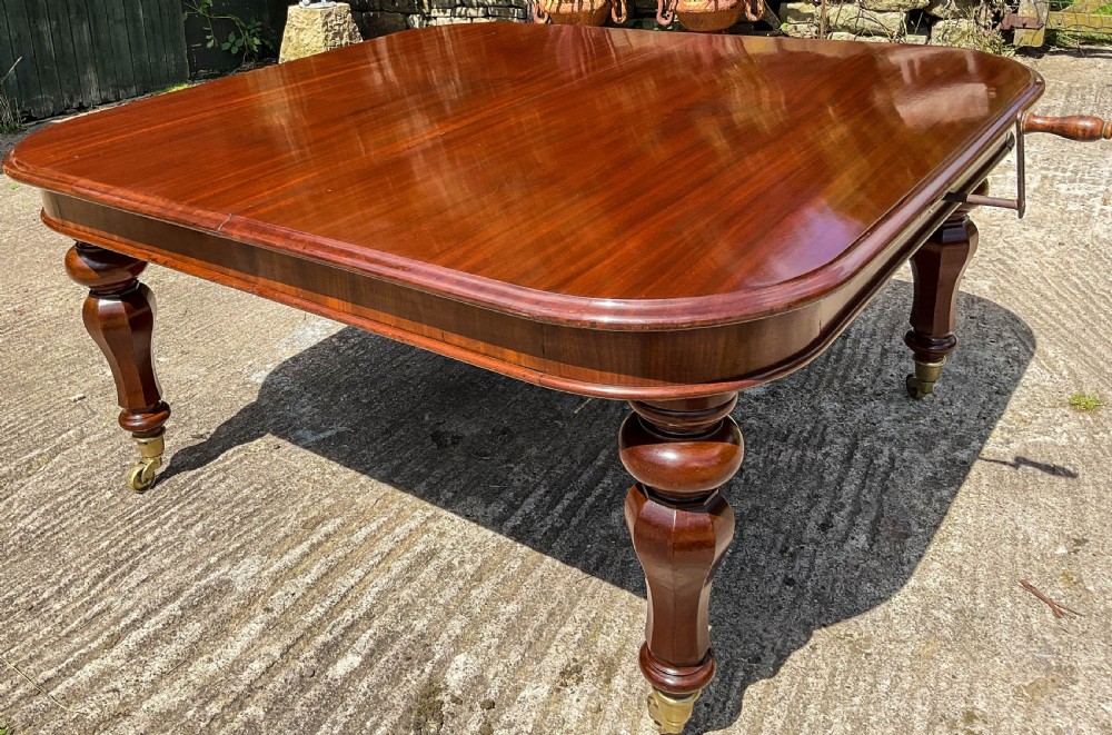 A Superb Early Victorian Extending Dining Table 4 leaves seats 12 View VII