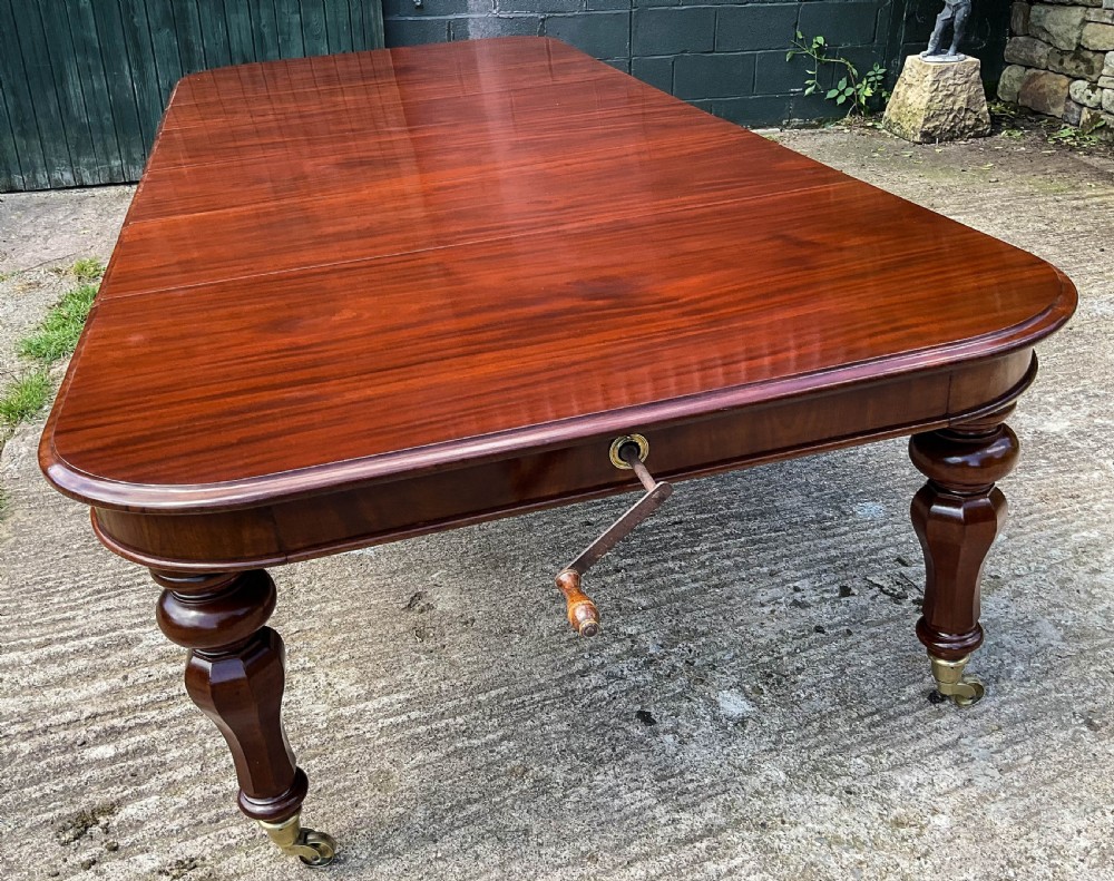 A Superb Early Victorian Extending Dining Table 4 leaves seats 12 View XI