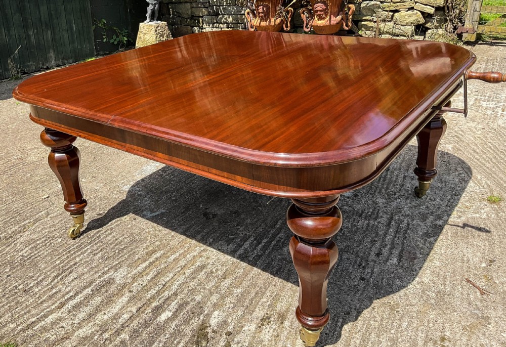 A Superb Early Victorian Extending Dining Table 4 leaves seats 12 View XV