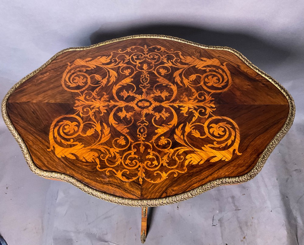 A super Kingwood and Rosewood  
 marquetry inlaid Table View V