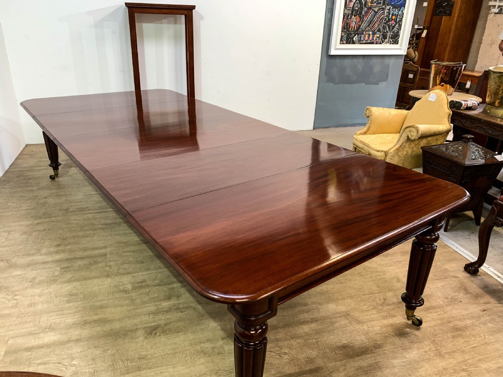 A Superb Georgian Extending Dining Table in Mahogany seats 12