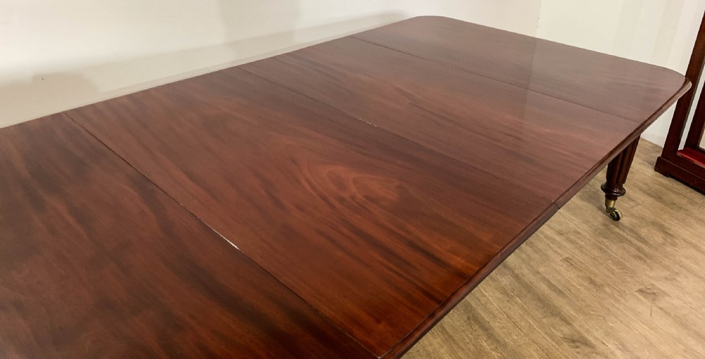 A Superb Georgian Extending Dining Table in Mahogany seats 12 View V