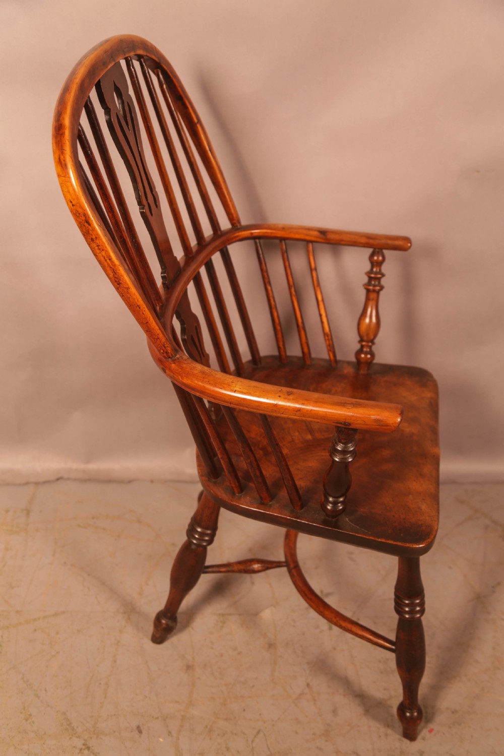 A 19th-century high back Windsor armchair made from yew wood with a shaped elm seat, turned legs, and a pierced decorative splat. View II