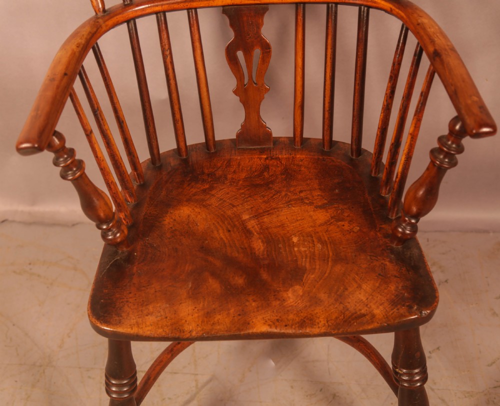 A 19th-century high back Windsor armchair made from yew wood with a shaped elm seat, turned legs, and a pierced decorative splat. View III