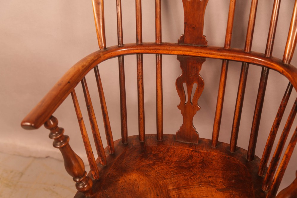 A 19th-century high back Windsor armchair made from yew wood with a shaped elm seat, turned legs, and a pierced decorative splat. View VI