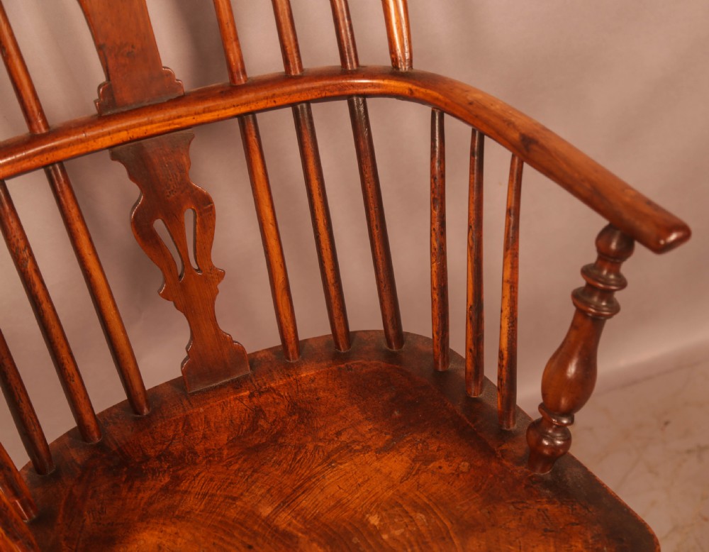 A 19th-century high back Windsor armchair made from yew wood with a shaped elm seat, turned legs, and a pierced decorative splat. View VII