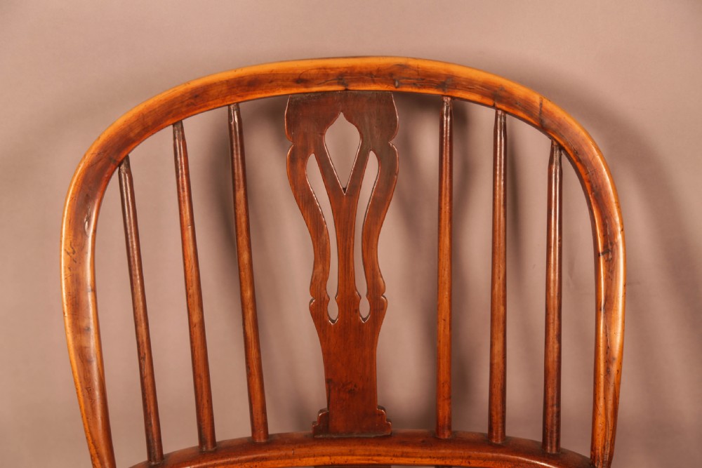 A 19th-century high back Windsor armchair made from yew wood with a shaped elm seat, turned legs, and a pierced decorative splat. View VIII