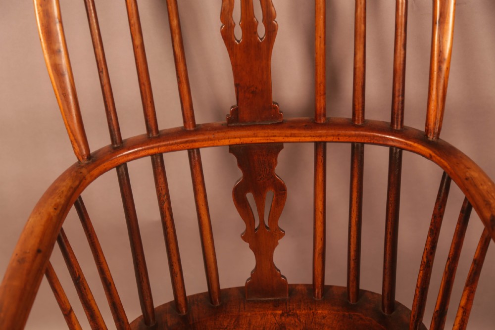 A 19th-century high back Windsor armchair made from yew wood with a shaped elm seat, turned legs, and a pierced decorative splat. View IX