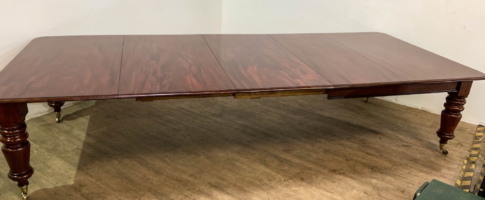 A superb Early Victorian Mahogany Extending dining Table with 3 leaves seat 14 View VI