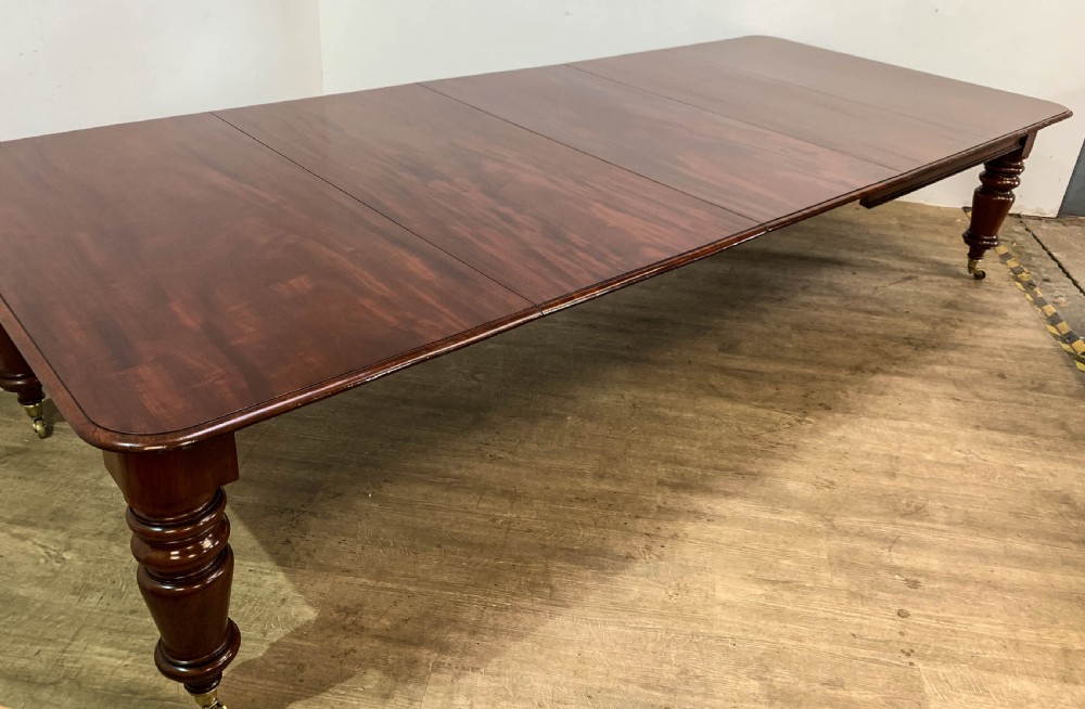 A superb Early Victorian Mahogany Extending dining Table with 3 leaves seat 14 View X