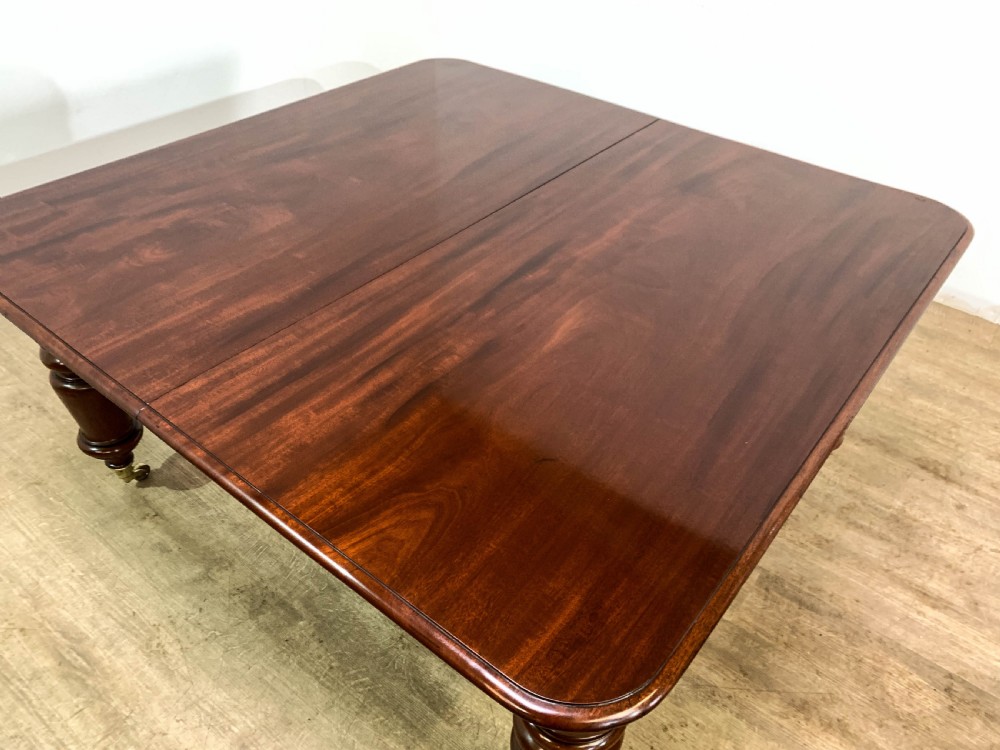 A superb Early Victorian Mahogany Extending dining Table with 3 leaves seat 14 View XIV